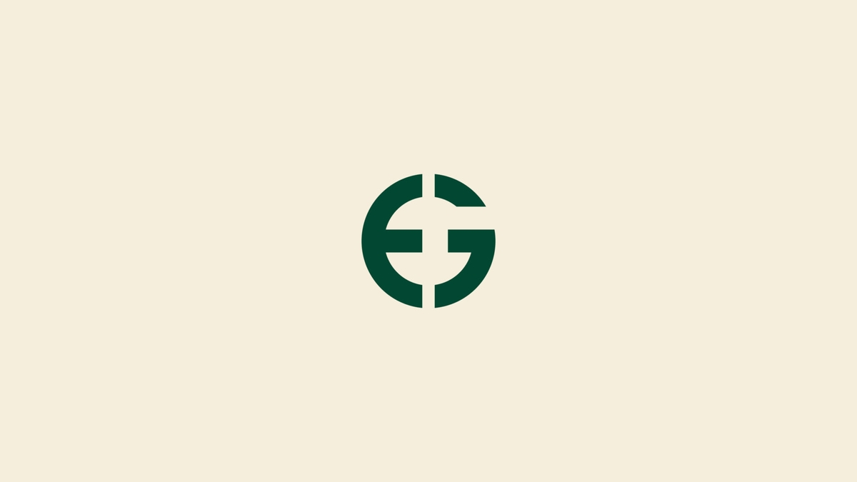 East Guardian graphic identity showing logo applications on business materials